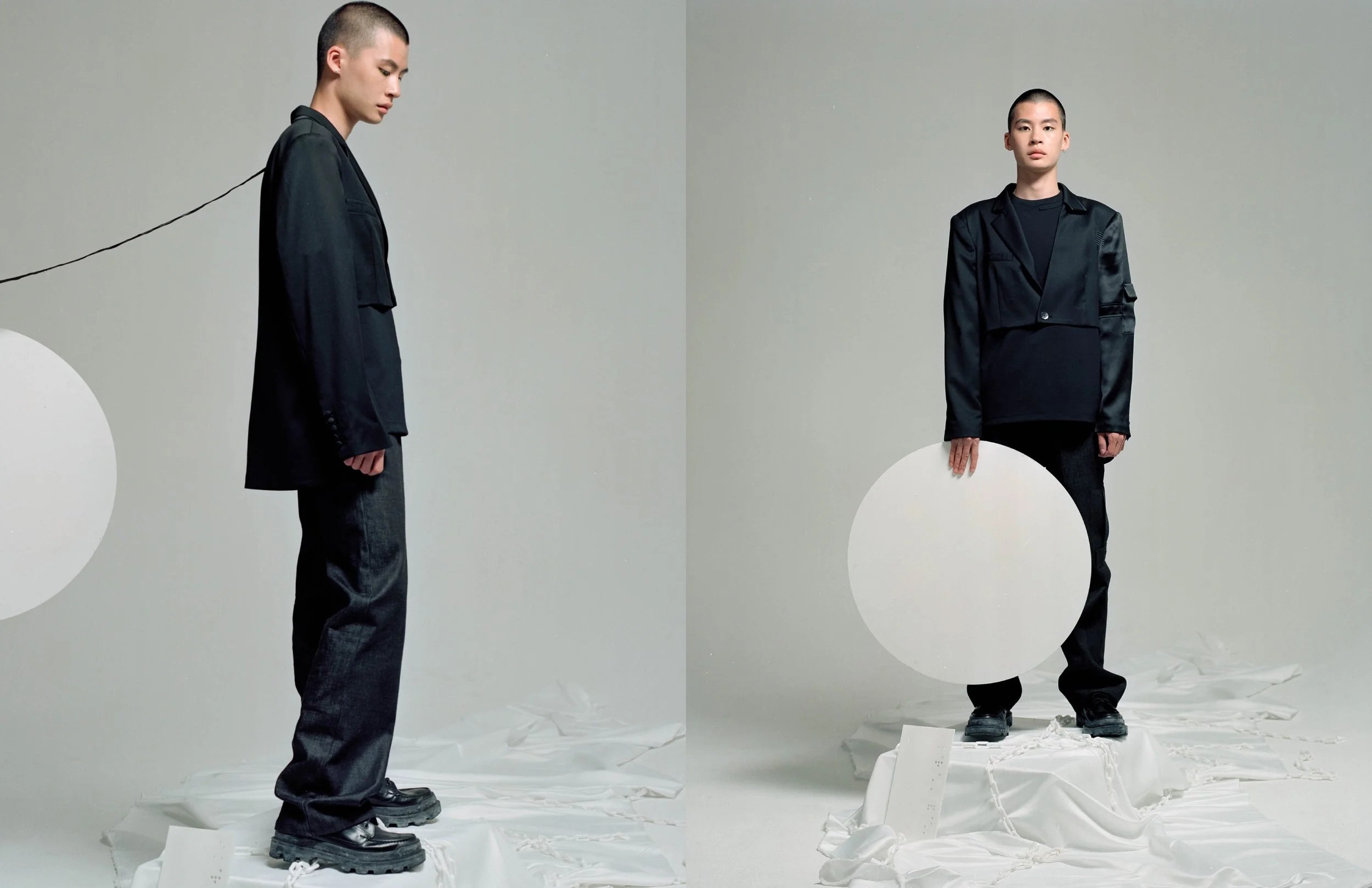SITWIDSEOUL campaign: model in black tailoring with a white circle on a grey set